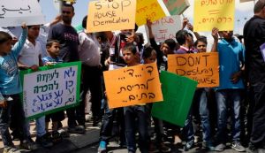 Demonstrators protesting against the planned evacuation of Bedouin villages in the Negev, June 11, 2015. Photo by Ilan Assayag